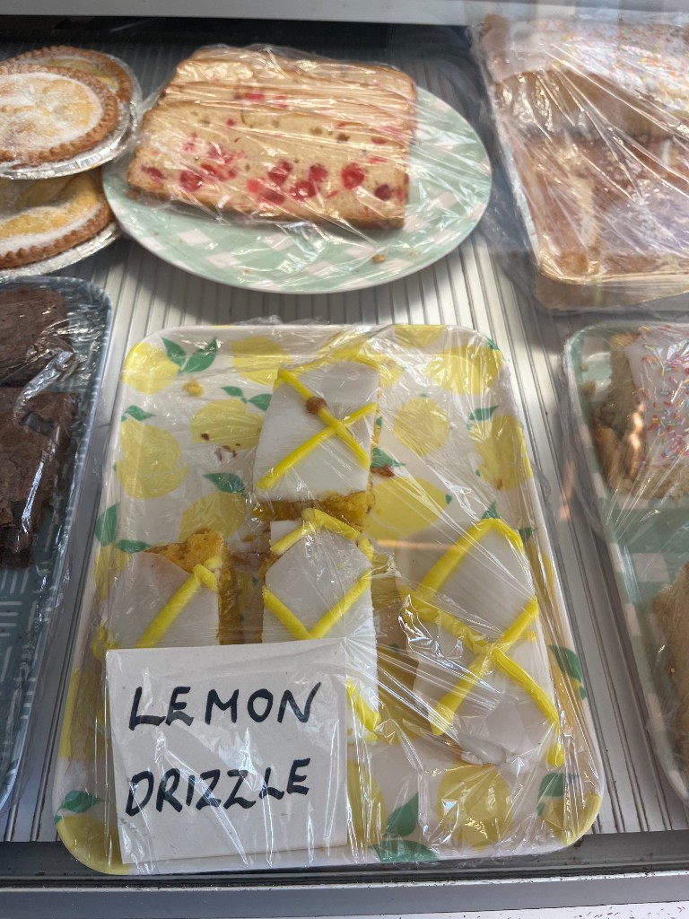 Lemon drizzle cake and treats in the chilled display counter