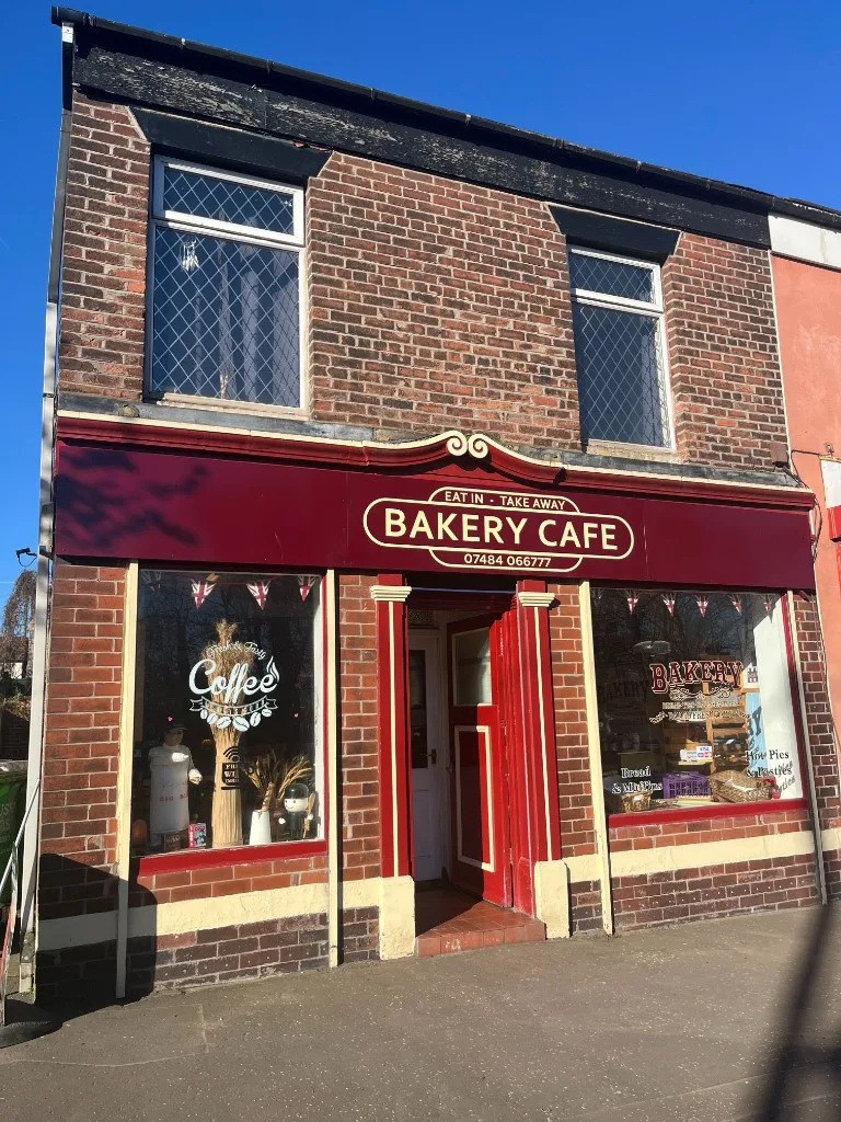 The Bakery Cafe shop front at 118 Manchester Street, Heywood, opposite the East Lancashire Railway station