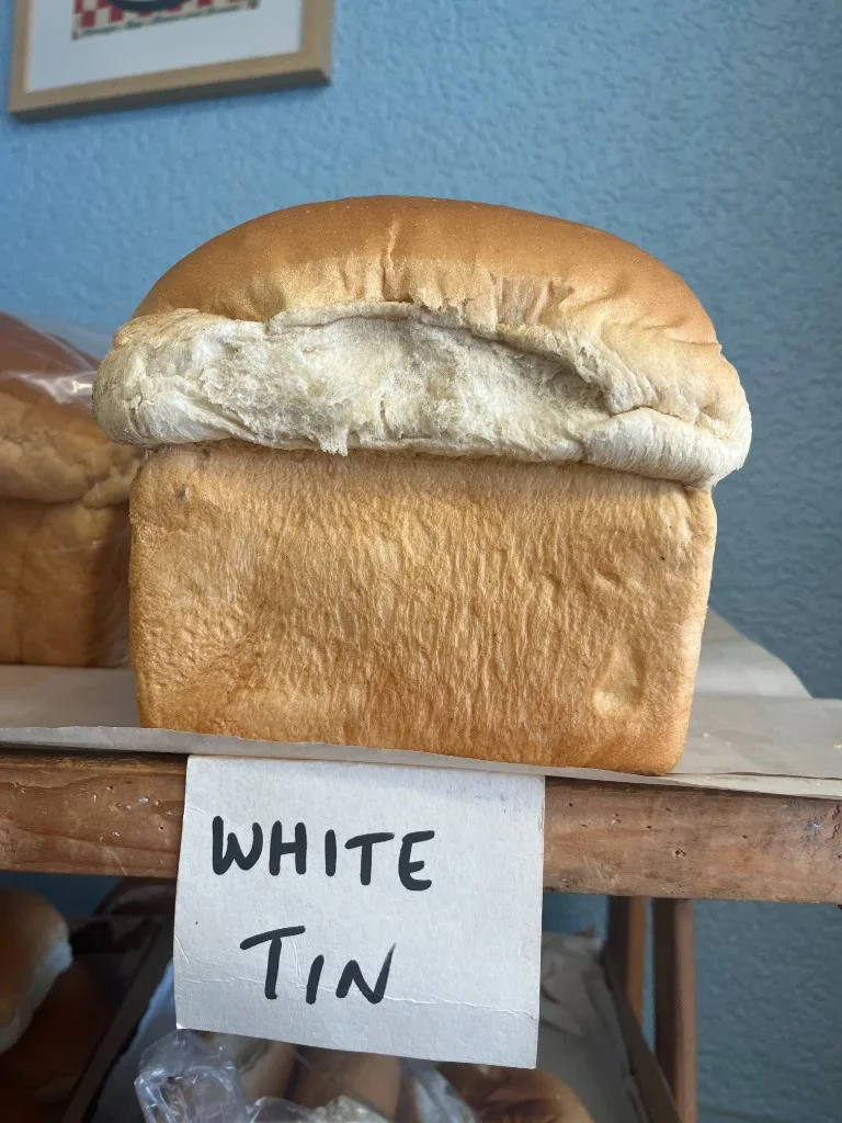 Fresh white tin loaf from Ernill's Bakery on display at The Bakery Cafe Heywood